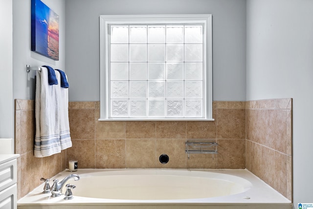full bathroom featuring a garden tub and plenty of natural light