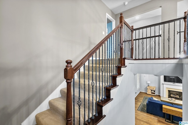 staircase with wood finished floors
