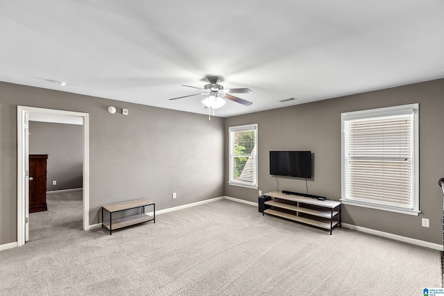 unfurnished room with ceiling fan, carpet, and baseboards