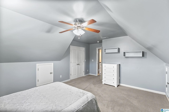 bedroom featuring vaulted ceiling, carpet floors, baseboards, and ceiling fan