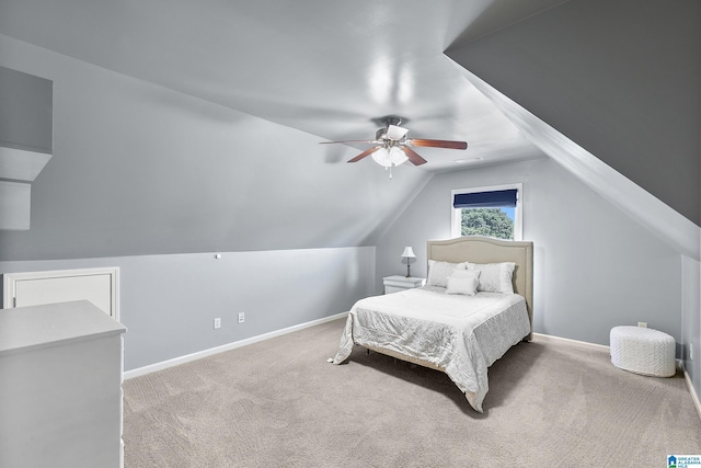 bedroom with carpet floors, lofted ceiling, baseboards, and a ceiling fan