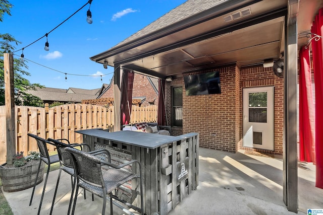 view of patio / terrace featuring fence