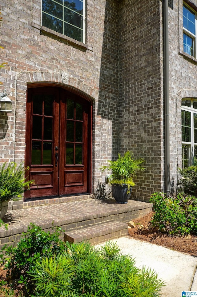 entrance to property with french doors and brick siding