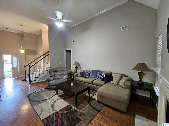 1082 Ivy Pl, Moody, AL 35004 - living room featuring wood finished floors, stairway, ceiling fan, crown molding, and high vaulted ceiling