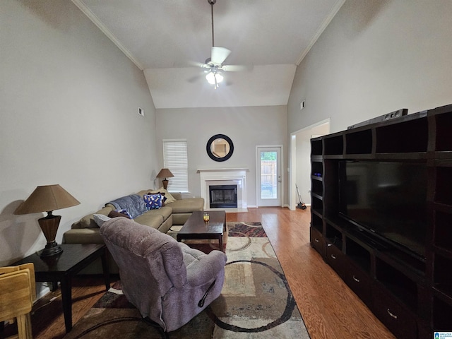 1082 Ivy Pl, Moody, AL 35004 - living area featuring ceiling fan, wood finished floors, crown molding, high vaulted ceiling, and a fireplace with flush hearth