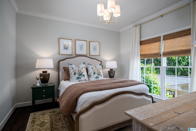 bedroom with baseboards, crown molding, dark wood finished floors, and a chandelier