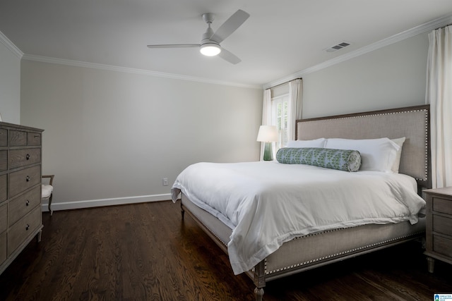 bedroom featuring ornamental molding, baseboards, dark wood-style floors, and ceiling fan