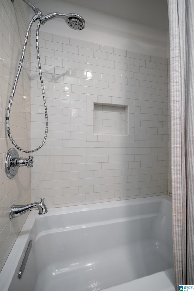 bathroom featuring shower / bath combo with shower curtain