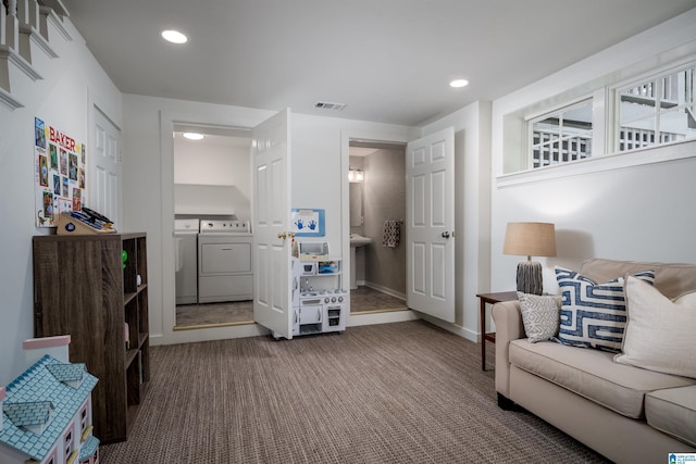 living area featuring washer and dryer, carpet floors, recessed lighting, and baseboards