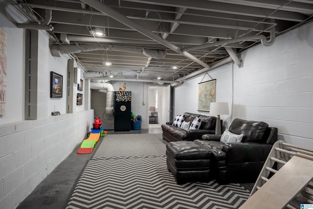 finished below grade area featuring concrete block wall