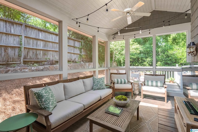 sunroom with outdoor lounge area, lofted ceiling, and a ceiling fan