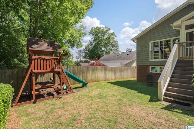 view of yard featuring a playground and stairway