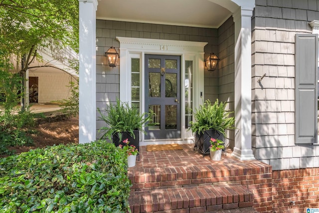 property entrance featuring covered porch