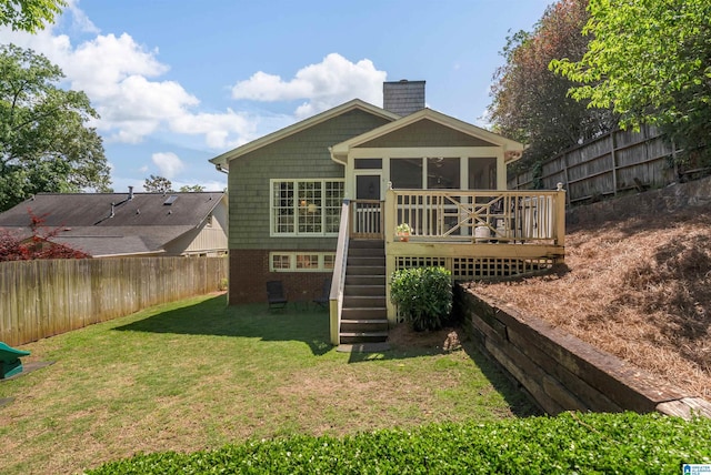 rear view of house featuring a sunroom, a chimney, stairs, a wooden deck, and brick siding
