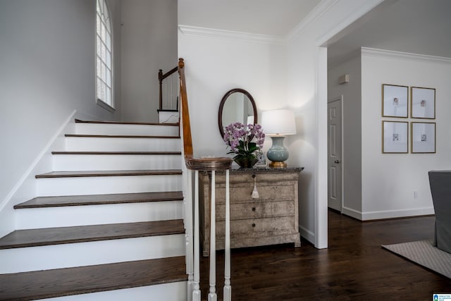 stairs with wood finished floors, crown molding, and baseboards