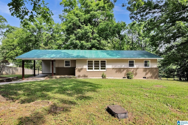 view of front of property featuring brick siding, metal roof, and a carport