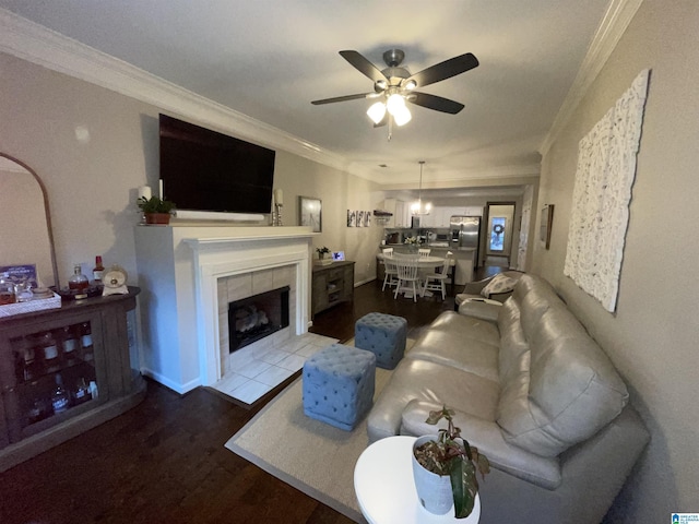 2232 Acton Park Cir, Birmingham, AL 35243 - living room with crown molding, a ceiling fan, dark wood-type flooring, and a tile fireplace