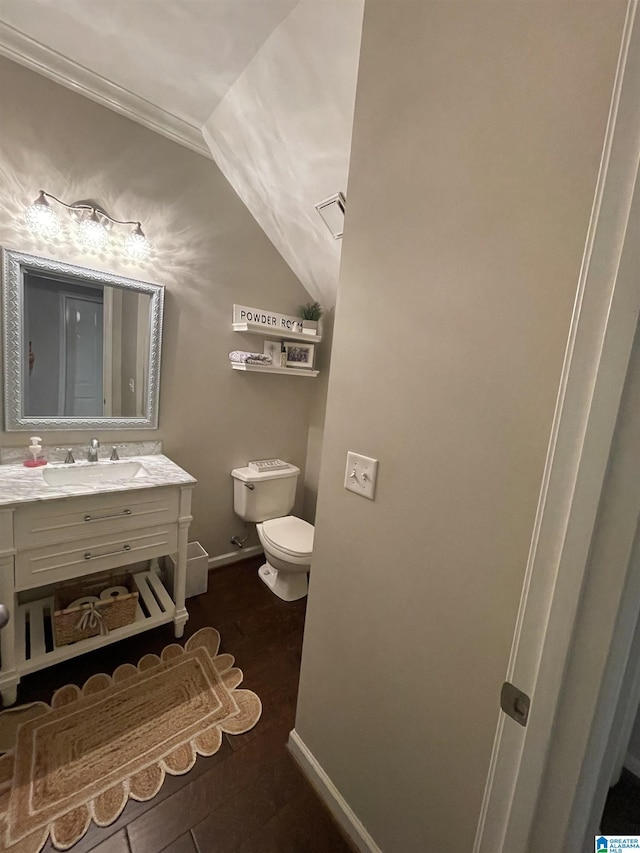 2232 Acton Park Cir, Birmingham, AL 35243 - bathroom with lofted ceiling, toilet, vanity, crown molding, and baseboards