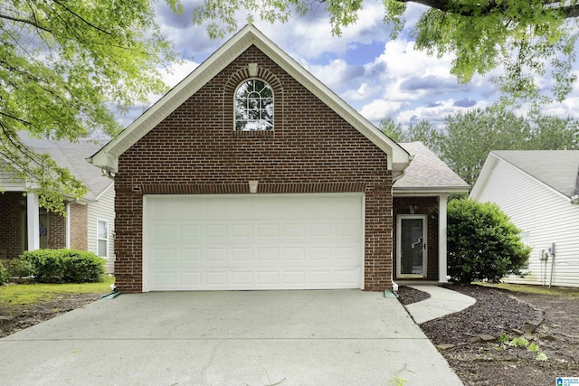 1656 Deer Valley Rd, Hoover, AL 35226 - view of front of house featuring brick siding, driveway, a garage, and roof with shingles