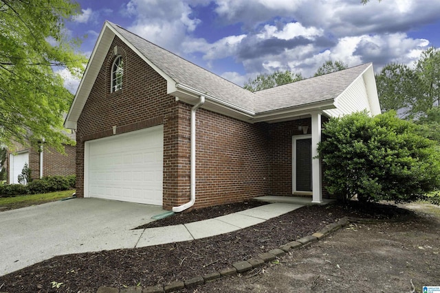 1656 Deer Valley Rd, Hoover, AL 35226 - view of front of home featuring brick siding, concrete driveway, and a shingled roof