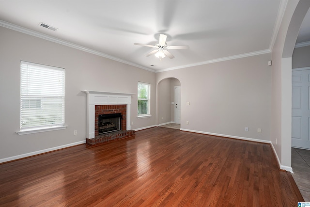 1656 Deer Valley Rd, Hoover, AL 35226 - unfurnished living room with arched walkways, ceiling fan, wood finished floors, crown molding, and baseboards