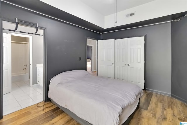 4017 Milner Way, Birmingham, AL 35242 - bedroom with wood finished floors, a closet, and connected bathroom