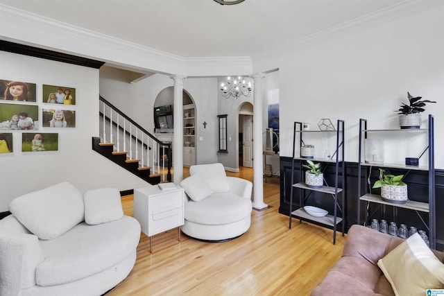 4017 Milner Way, Birmingham, AL 35242 - living room with arched walkways, wood finished floors, ornamental molding, decorative columns, and stairs