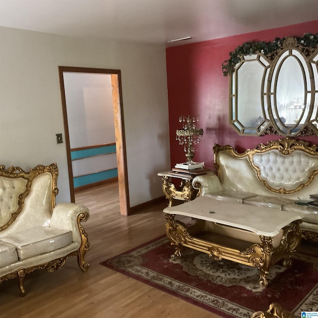 living area featuring wood finished floors and baseboards