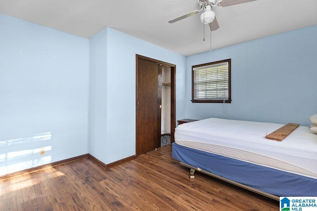 5241 County Road 48, Jemison, AL 35085 - bedroom featuring wood finished floors, baseboards, ceiling fan, and a closet