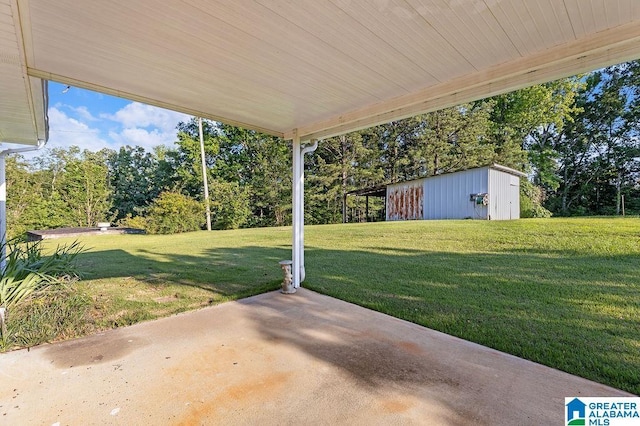 5241 County Road 48, Jemison, AL 35085 - view of patio with an outdoor structure and view of wooded area