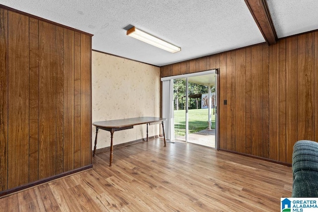 5241 County Road 48, Jemison, AL 35085 - unfurnished dining area with wood finished floors, a textured ceiling, wooden walls, and beamed ceiling