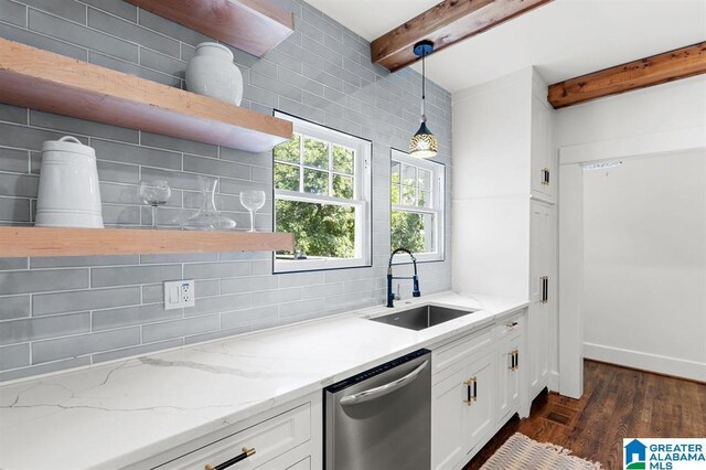 kitchen with open shelves, dishwasher, a sink, beam ceiling, and backsplash