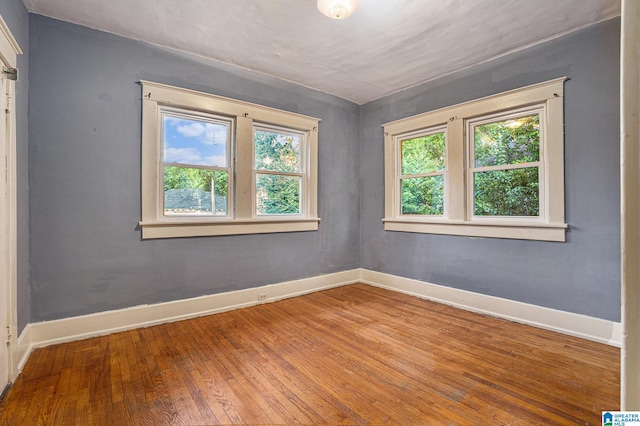 728 41st St, Fairfield, AL 35064 - spare room featuring hardwood / wood-style flooring and baseboards