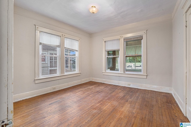 728 41st St, Fairfield, AL 35064 - empty room featuring plenty of natural light, hardwood / wood-style floors, and baseboards