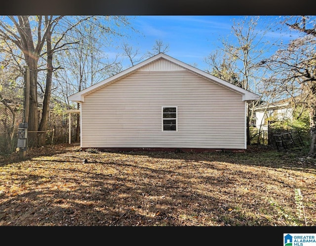 view of home's exterior with fence