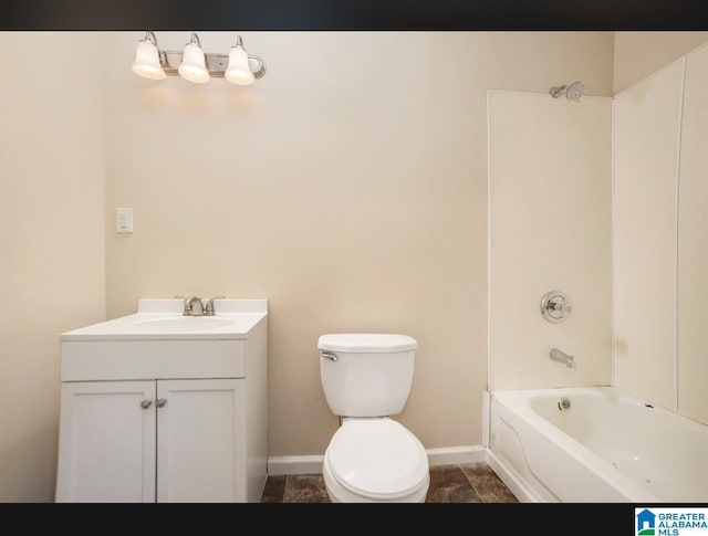 full bathroom featuring vanity, toilet, tub / shower combination, and baseboards