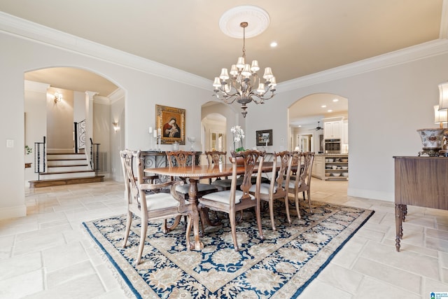 4035 Saint Charles Dr, Hoover, AL 35242 - dining space with ornamental molding, stone tile flooring, baseboards, stairway, and arched walkways