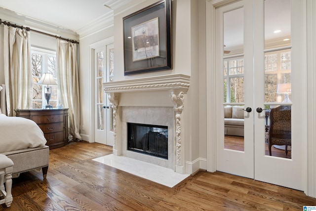 4035 Saint Charles Dr, Hoover, AL 35242 - bedroom featuring ornamental molding, wood finished floors, a fireplace, french doors, and recessed lighting