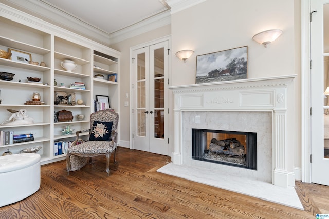 4035 Saint Charles Dr, Hoover, AL 35242 - sitting room with french doors, wood finished floors, ornamental molding, and a high end fireplace