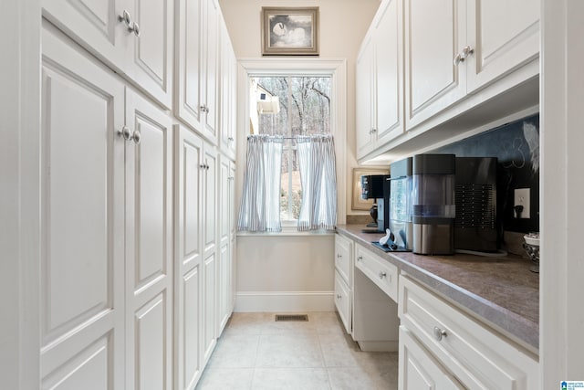 4035 Saint Charles Dr, Hoover, AL 35242 - kitchen featuring light tile patterned flooring, white cabinets, and baseboards