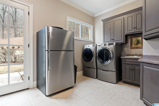 4035 Saint Charles Dr, Hoover, AL 35242 - clothes washing area featuring ornamental molding, independent washer and dryer, and light tile patterned flooring