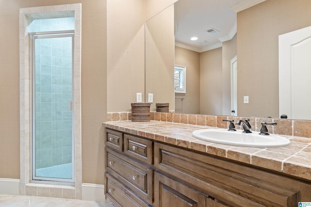 4035 Saint Charles Dr, Hoover, AL 35242 - bathroom featuring a stall shower, crown molding, and vanity