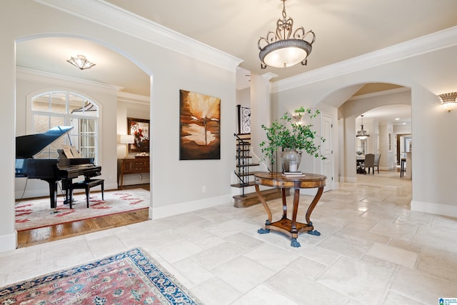 4035 Saint Charles Dr, Hoover, AL 35242 - entrance foyer featuring arched walkways, crown molding, baseboards, and stone tile flooring