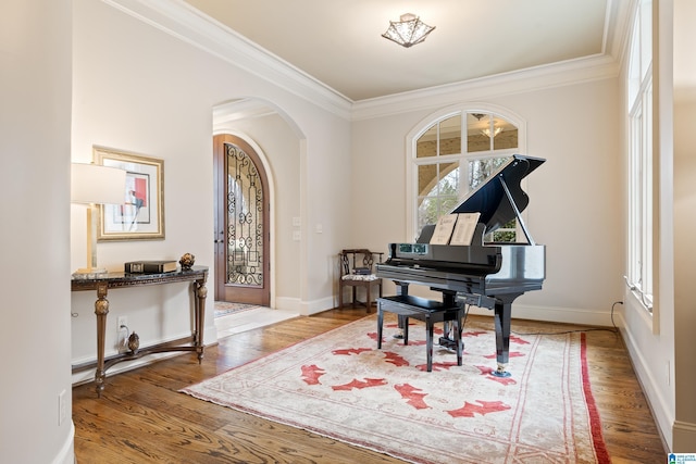 4035 Saint Charles Dr, Hoover, AL 35242 - living area with ornamental molding, arched walkways, wood finished floors, and baseboards