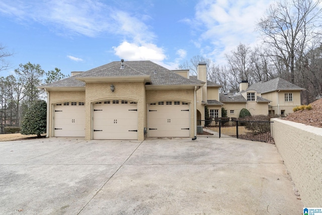 4035 Saint Charles Dr, Hoover, AL 35242 - view of property exterior featuring a garage, driveway, fence, brick siding, and a shingled roof