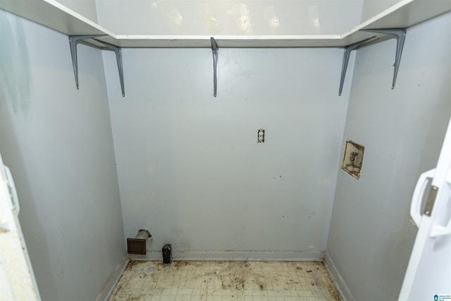 laundry room with washer hookup and baseboards