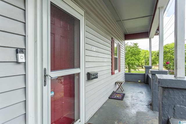 doorway to property with covered porch