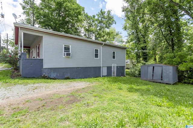 view of side of property with a shed and an outbuilding