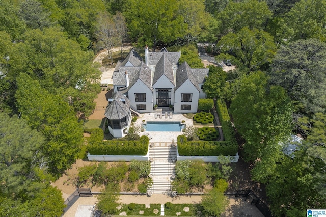 view of subject property with a pool area