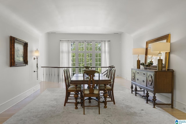 dining area with wood finished floors and baseboards